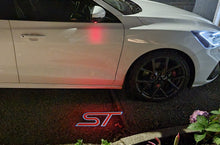 Load image into Gallery viewer, “ST” Emblem Replacement Puddle Unit - MK4 / MK4.5 Focus ST (Multiple Colours)