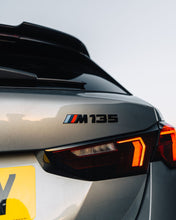 Load image into Gallery viewer, BMW M135i M Performance Black High Gloss Model Badge – Genuine OEM Emblem for 1 Series M135i/M135 xDrive (F20 F21 F40 F70) 2011–2025 Rear Boot/Tailgate