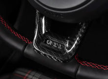 Load image into Gallery viewer, ECS Tuning Steering Wheel Hub Overlay - Black Carbon Fibre - Golf MK7/MK7.5
